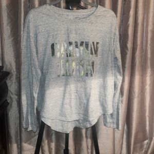 Calvin Klein Jeans Long sleeve shirt. Size M. Color grey & camouflage lettering.